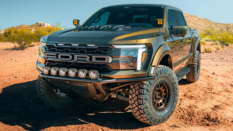 Lifted Ford F-150 Raptor R with off-road light bar and bronze wheels