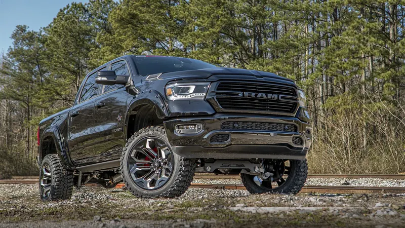 Black Ram 1500 Black Widow lifted truck with SCA suspension and mud-terrain tires