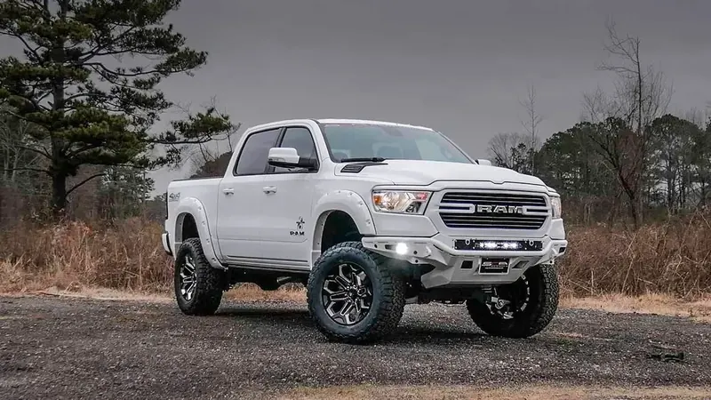 White Ram 1500 Black Widow lifted truck with LED light bar